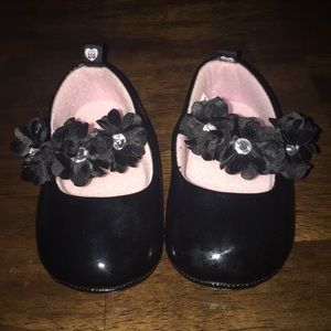 Adorable black infant dress shoes.